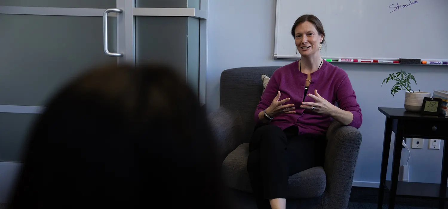 Dr. Katie Hirst speaks to a client or colleague