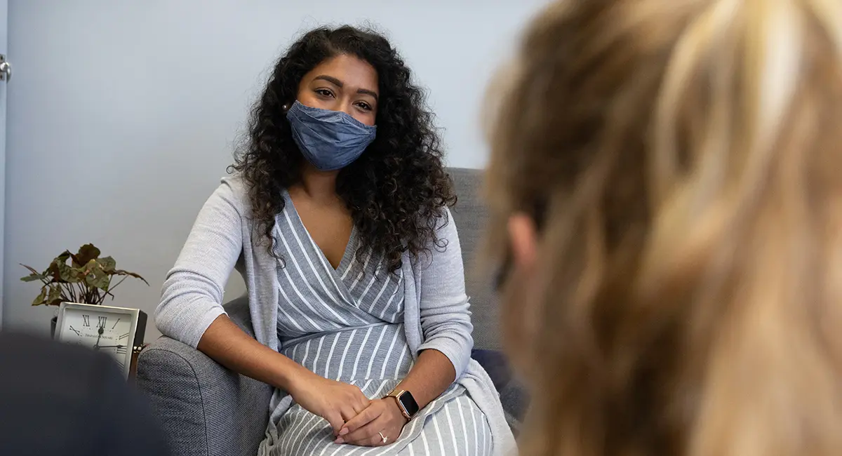 An adolescent client attends a therapy session