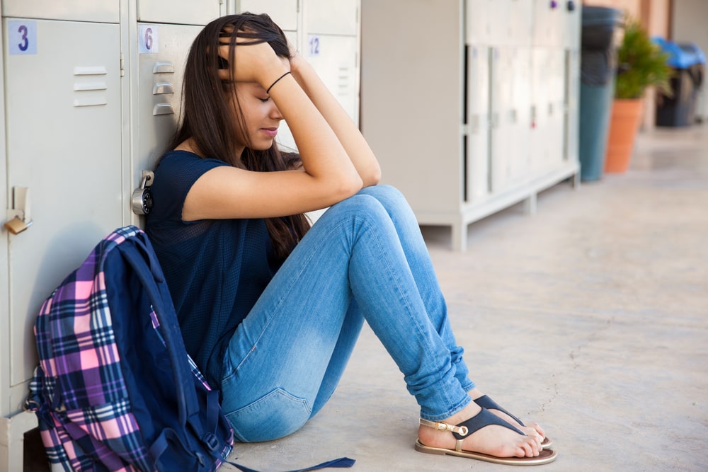 teen dealing with stress from school

