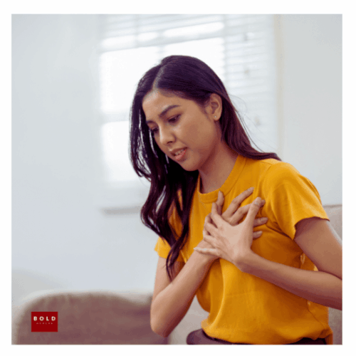 A close-up of a person practicing a deep breathing grounding technique to calm somatic anxiety symptoms.