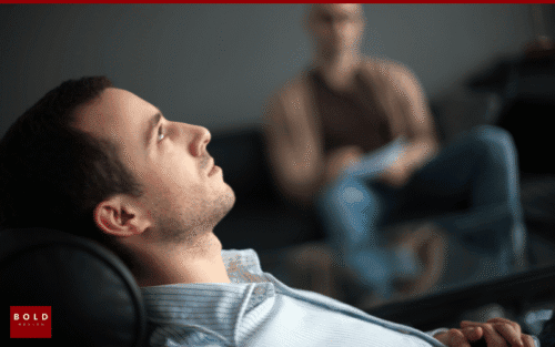 man reclined receiving therapy
